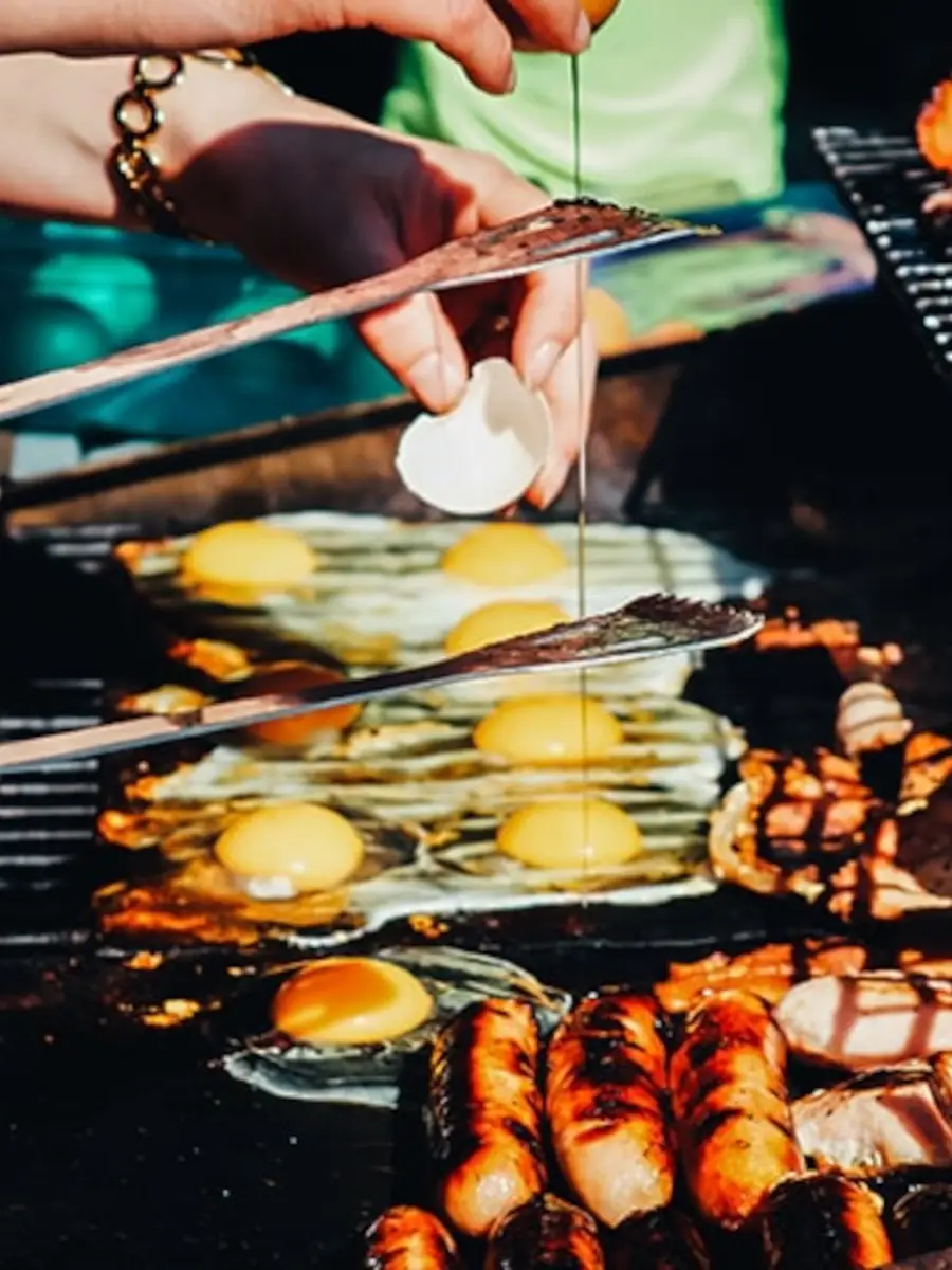 Breakfast being cooked on an outdoor grill