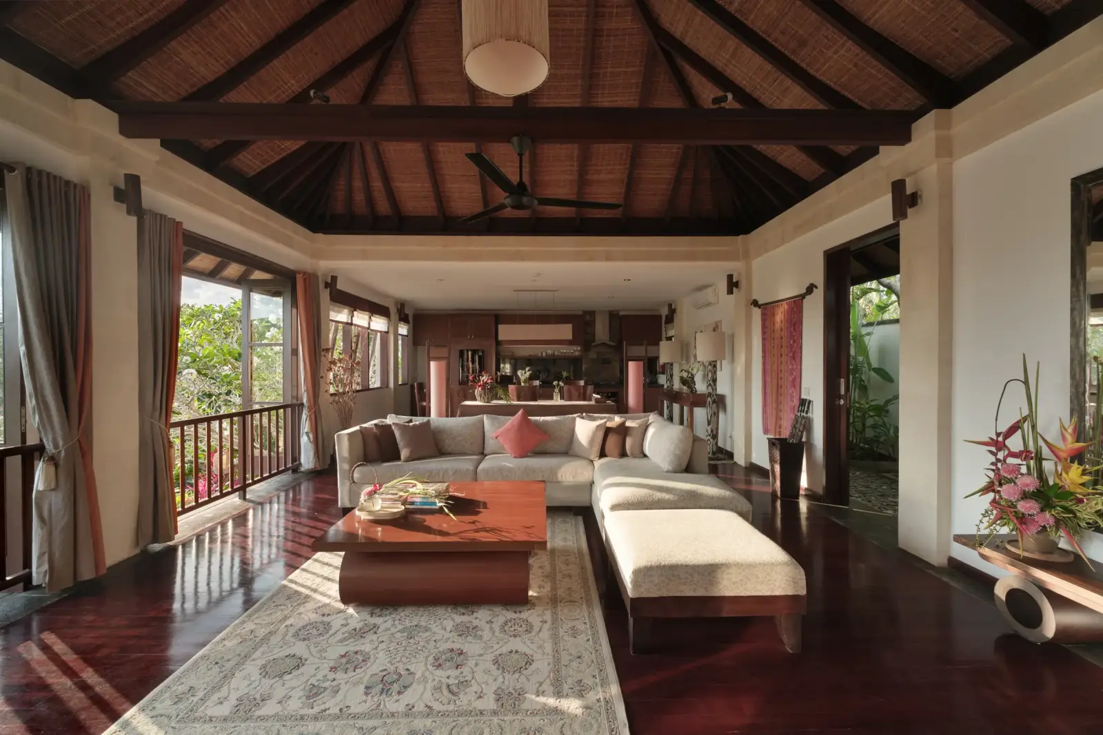 Villa Ambiente — Upstairs living room under a timber roof