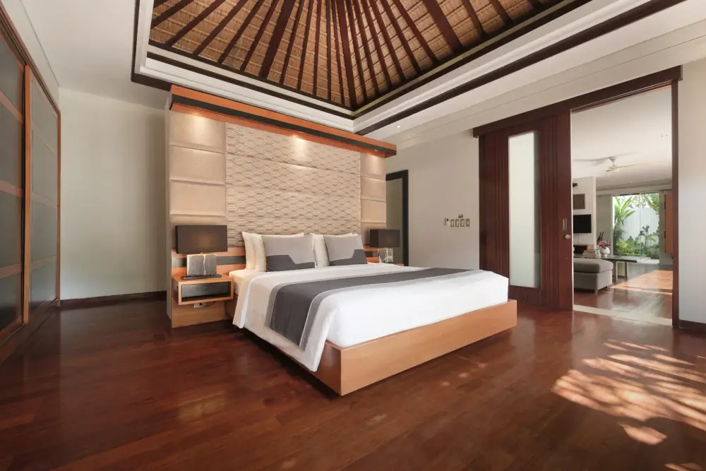 Villa Camellia — Ground-floor master bedroom under a timber roof
