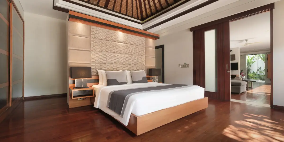 Villa Camellia — Ground-floor master bedroom under a timber roof
