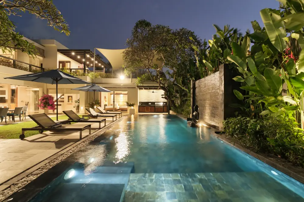 Villa Camellia — Lap pool and water wall at night