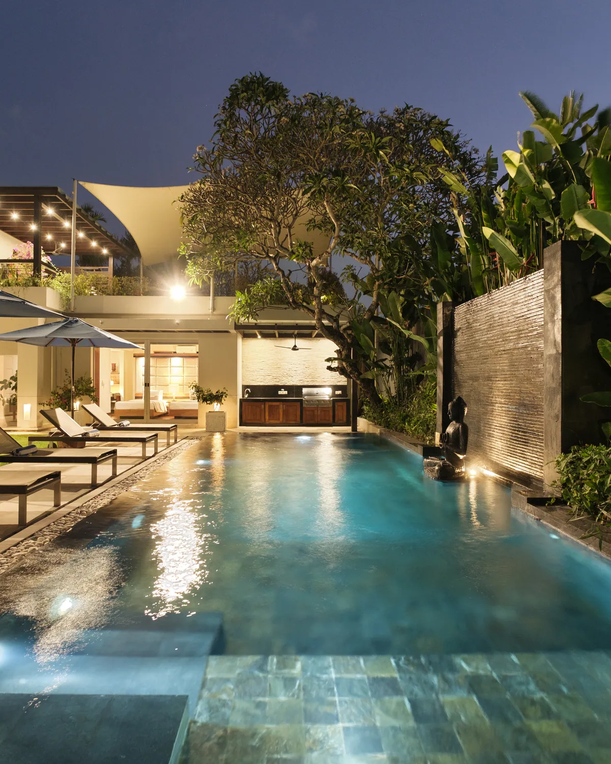 Villa Camellia lap pool and house at dusk