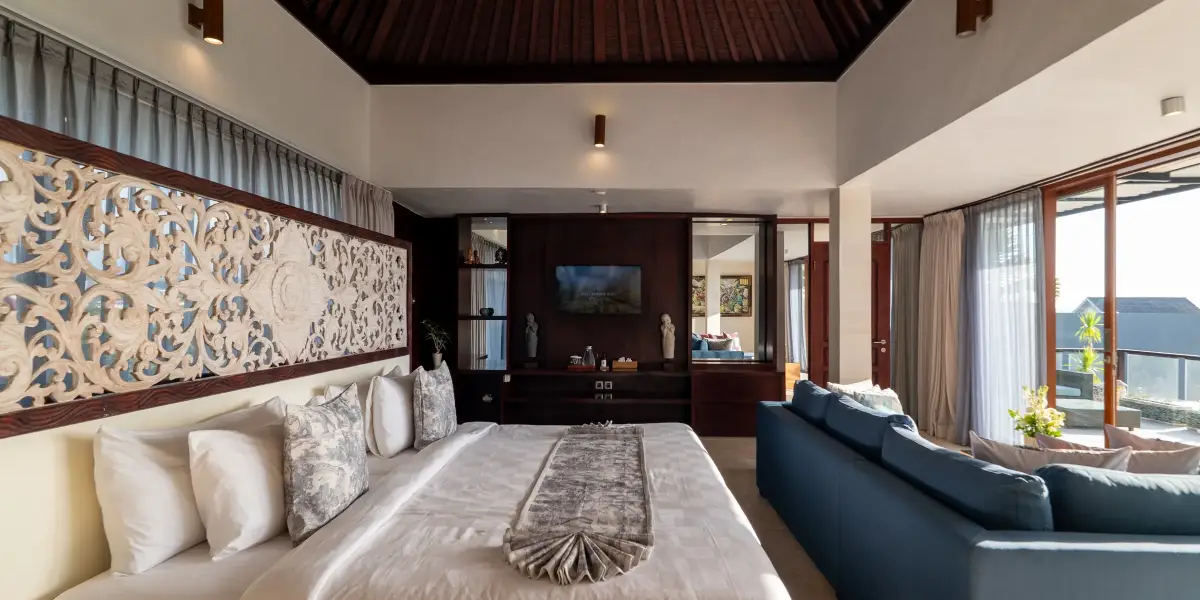 Villa Rayana — Upper-floor suite with a hand-carved panel
