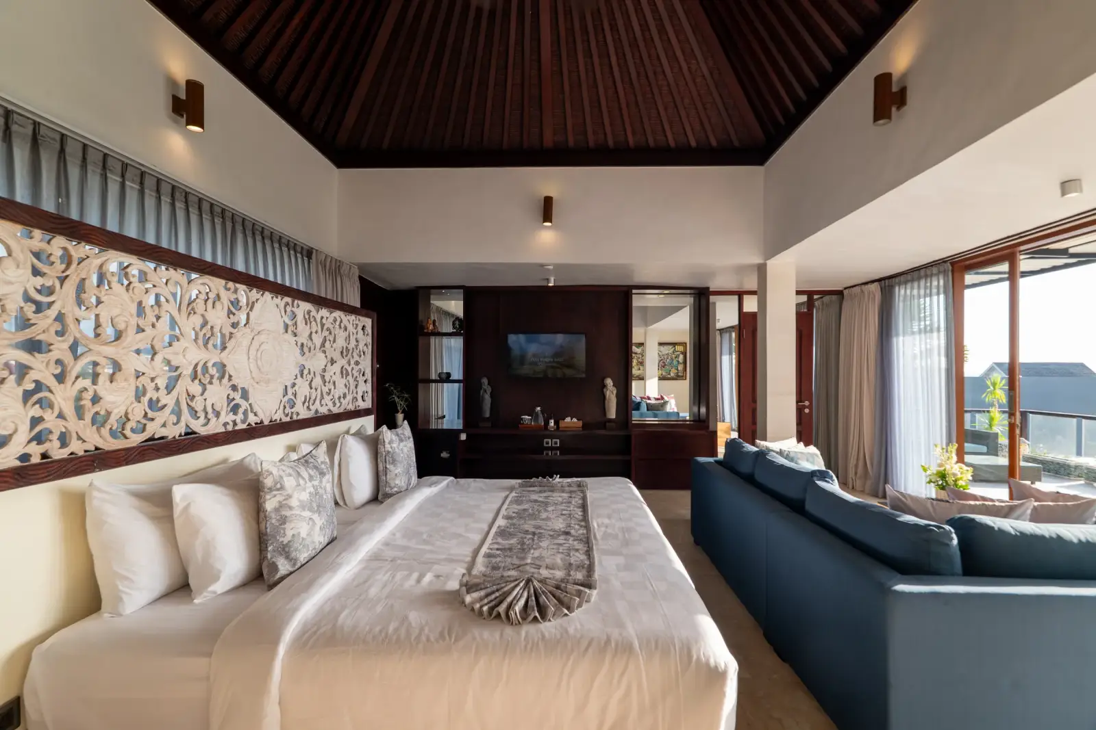 Villa Rayana — Upper-floor suite with a hand-carved panel